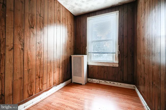 a view of a elevator with wooden floor
