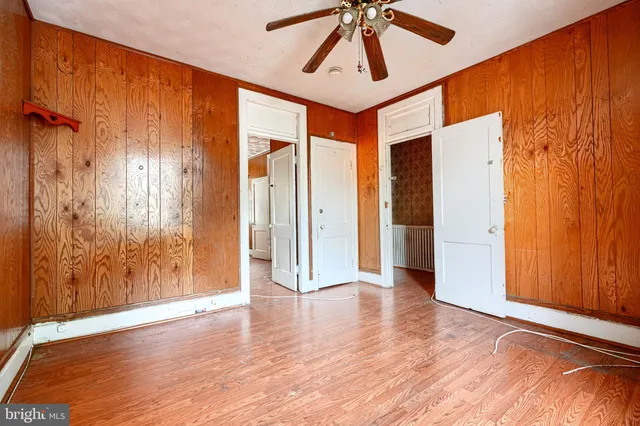 a kitchen with stainless steel appliances granite countertop a sink and a refrigerator