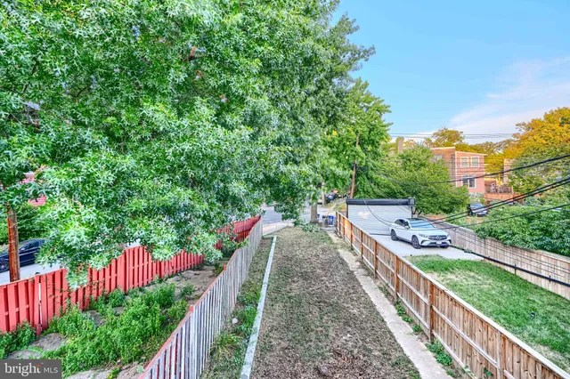 a view of a room with a bed and a window