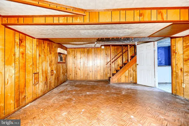 a view of a refrigerator with wooden cabinets