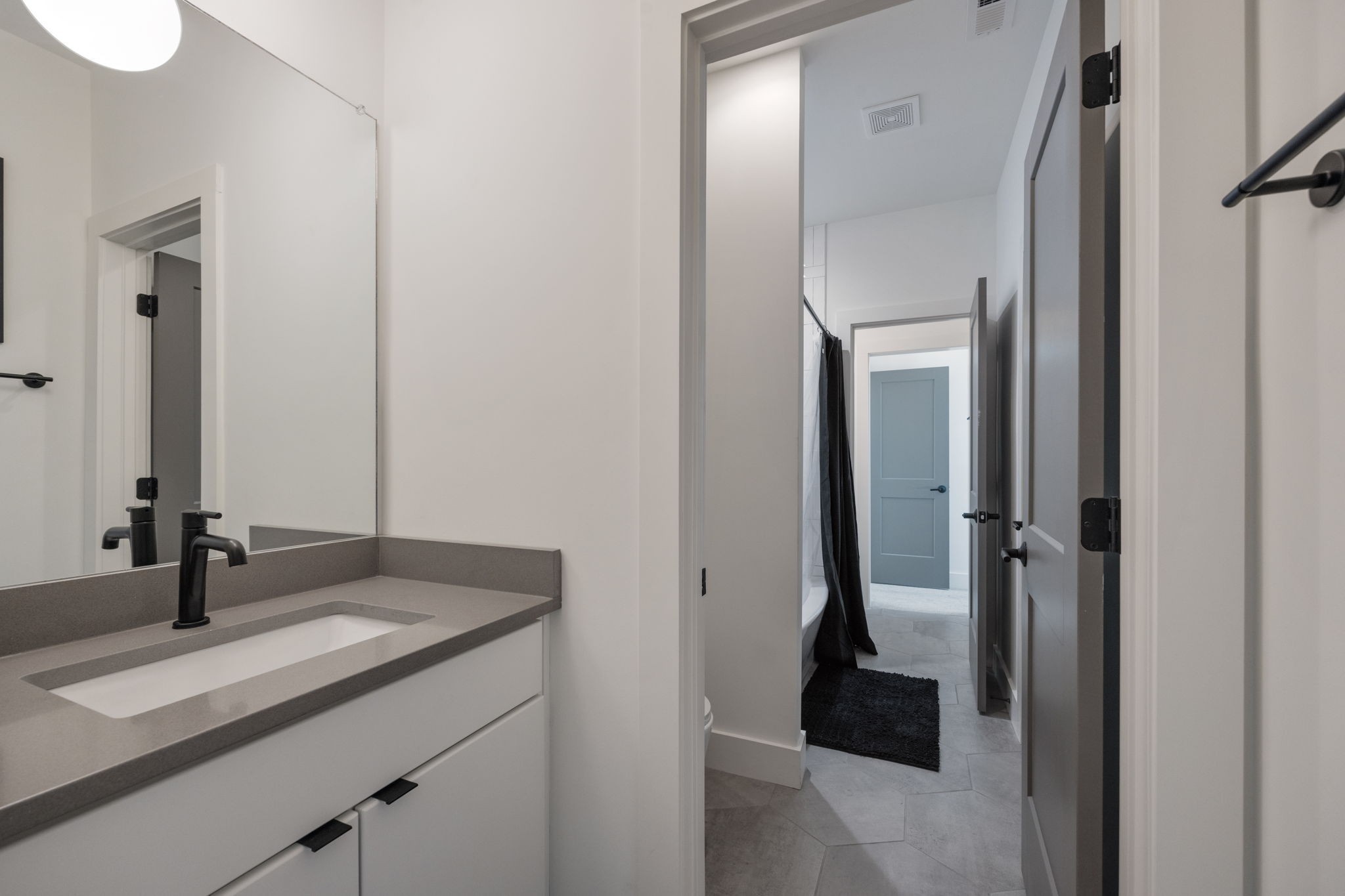 1007 Summit Avenue Nashville, TN 37203 - Photo 31 of 45 a bathroom with a granite countertop sink and a mirror