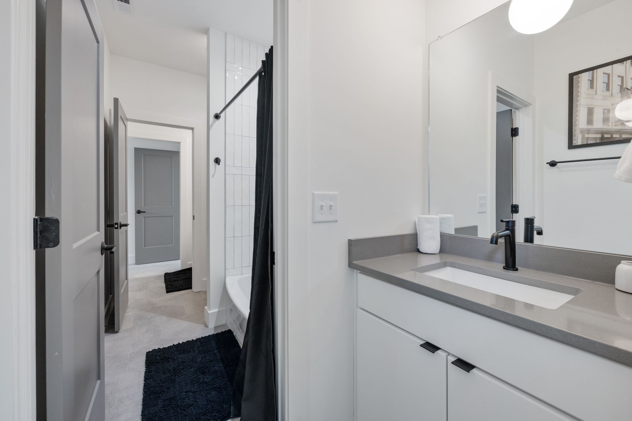 1007 Summit Avenue Nashville, TN 37203 - Photo 33 of 45 a bathroom with a granite countertop sink and a mirror