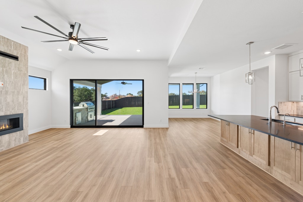 3408 Emerald Lake Path Georgetown, TX 78628 - Photo 11 of 38 a view of an empty room with window and wooden floor