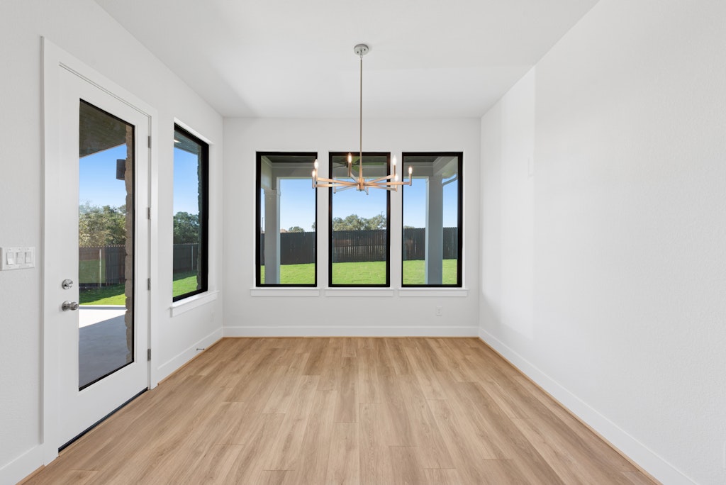 3408 Emerald Lake Path Georgetown, TX 78628 - Photo 16 of 38 a view of an empty room with glass door