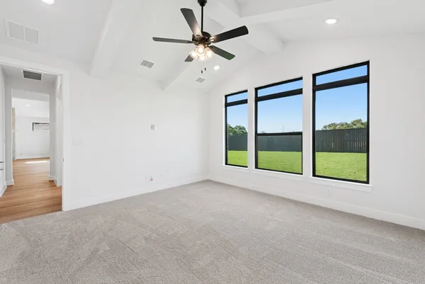 a view of an empty room with a window