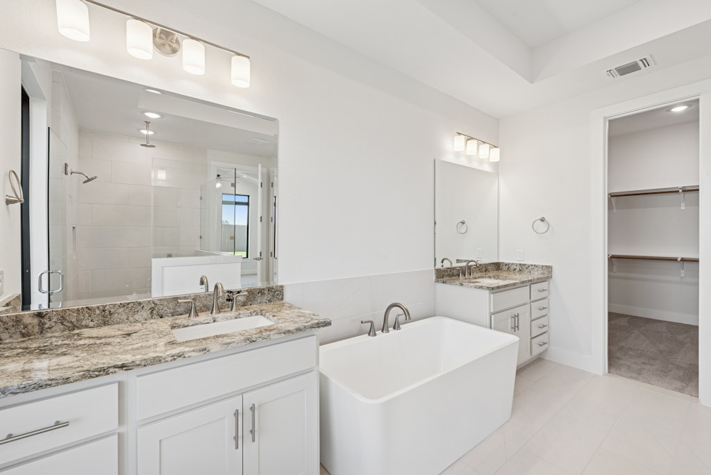 3408 Emerald Lake Path Georgetown, TX 78628 - Photo 22 of 38 a bathroom with a sink double vanity and a mirror