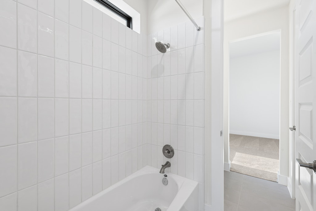 3408 Emerald Lake Path Georgetown, TX 78628 - Photo 28 of 38 a bathroom with a bathtub