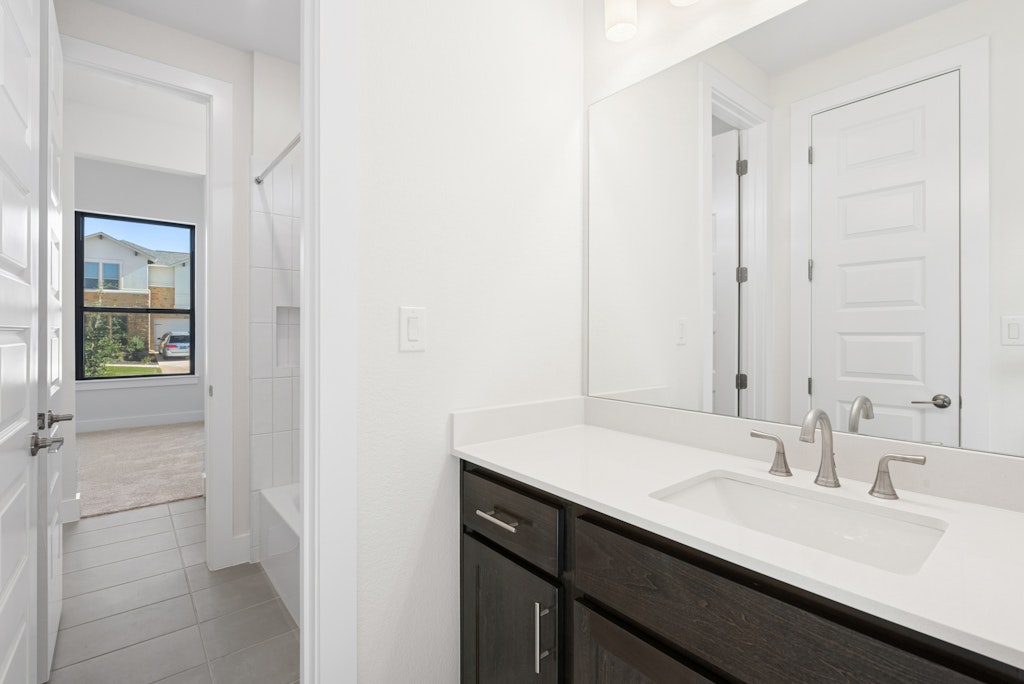 3408 Emerald Lake Path Georgetown, TX 78628 - Photo 29 of 38 a bathroom with a sink and a mirror