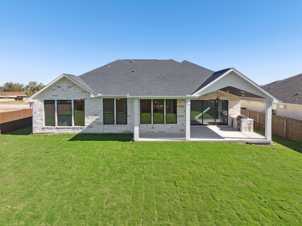 3408 Emerald Lake Path Georgetown, TX 78628 - Photo 36 of 38 a front view of a house with a yard and porch