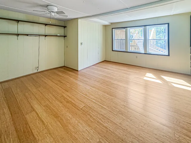 a view of an empty room and a window