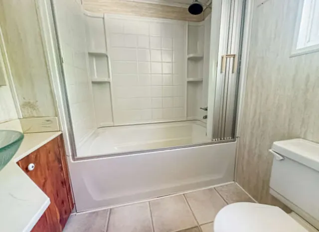 a bathroom with a tub and a shower