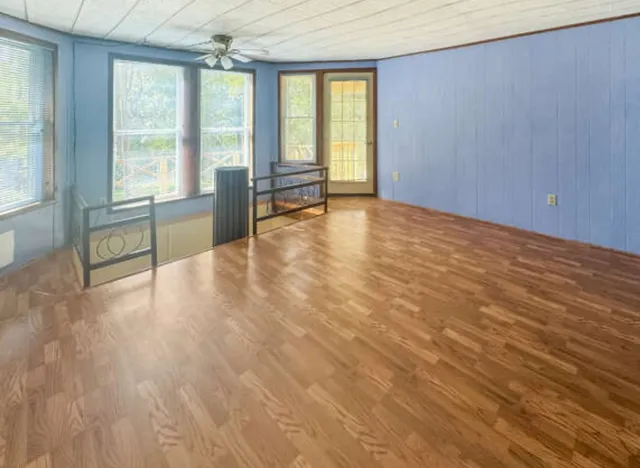 a view of an empty room with a window