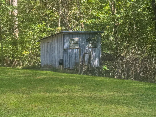 a backyard of a house with lots of green space
