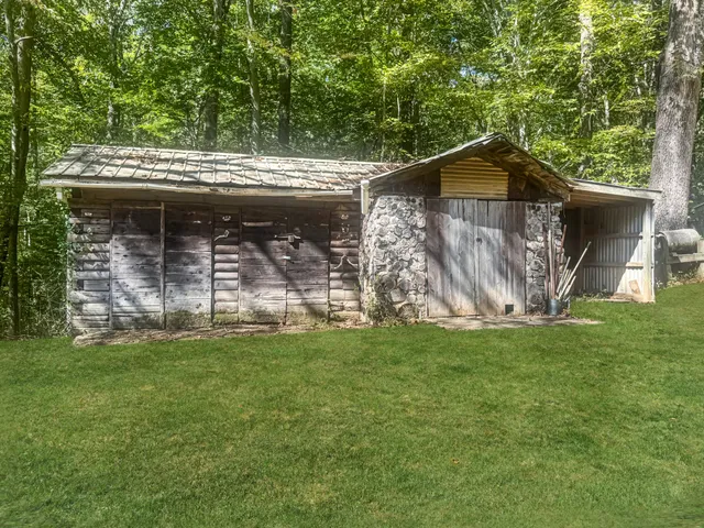 a view of a tiny house with a yard