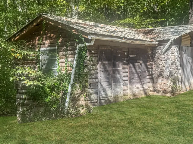 a backyard of a house with lots of green space
