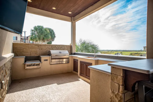 a view of a outdoor kitchen with a stove