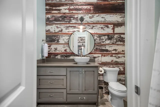 a bathroom with a toilet and a sink