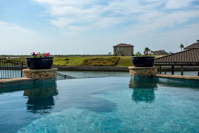 a view of a chairs and table in patio