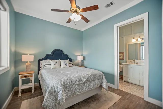 a bathroom with a sink vanity mirror and toilet