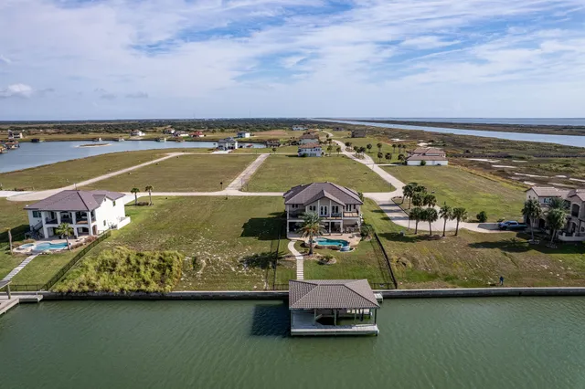 an aerial view of a house with a ocean view