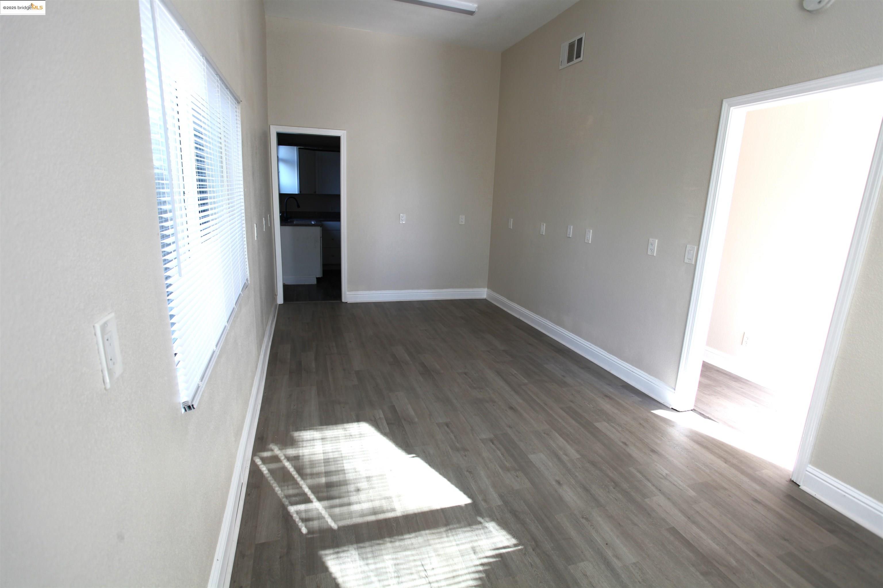 50 Main Street Isleton, CA 95641 - Photo 16 of 59 an empty room with wooden floor and closet