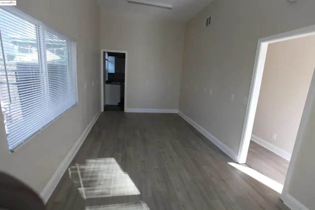 a kitchen with stainless steel appliances a stove a sink and a microwave
