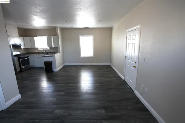a bathroom with a granite countertop toilet a sink and bathtub