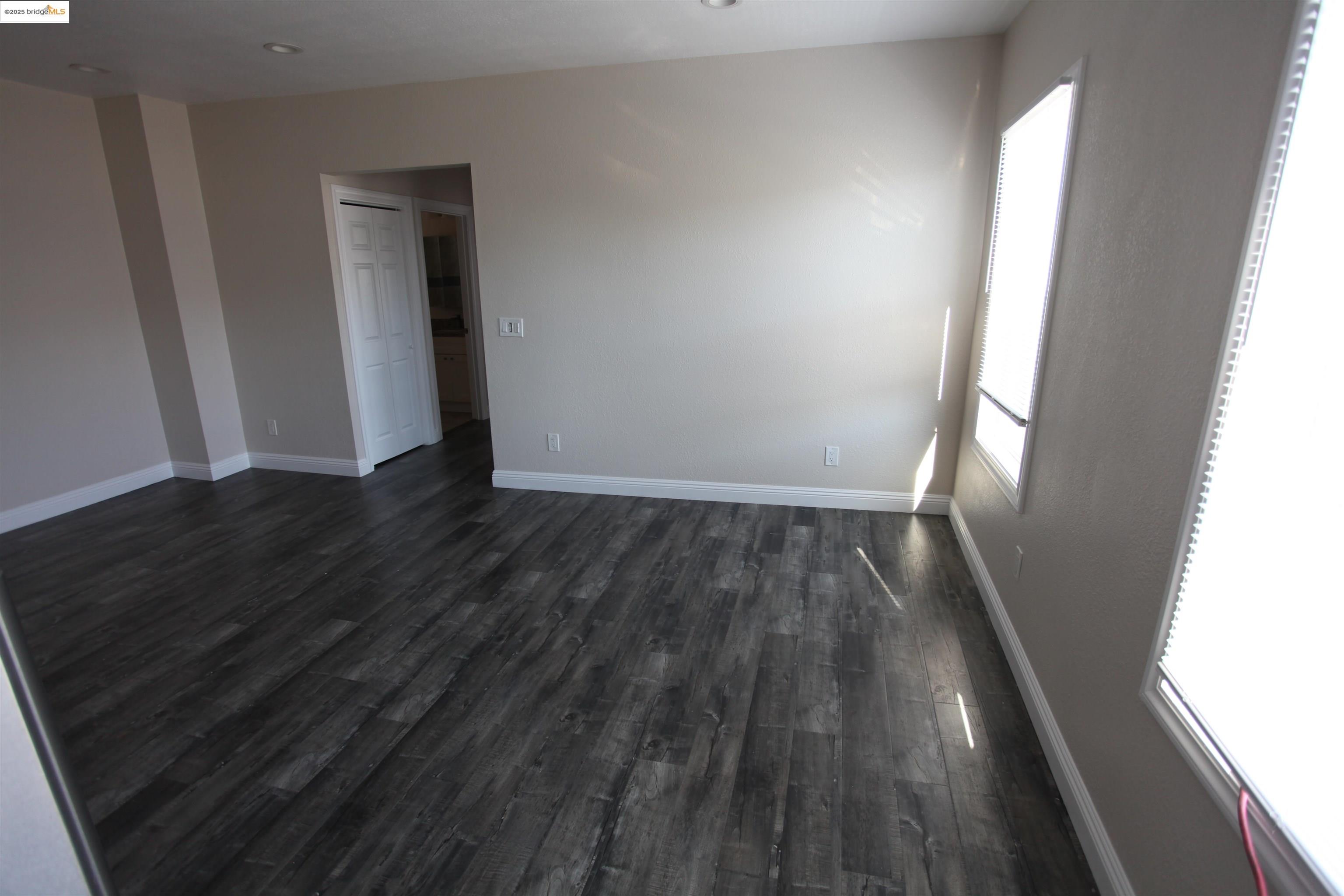 50 Main Street Isleton, CA 95641 - Photo 48 of 59 a view of wooden floor and windows in a room