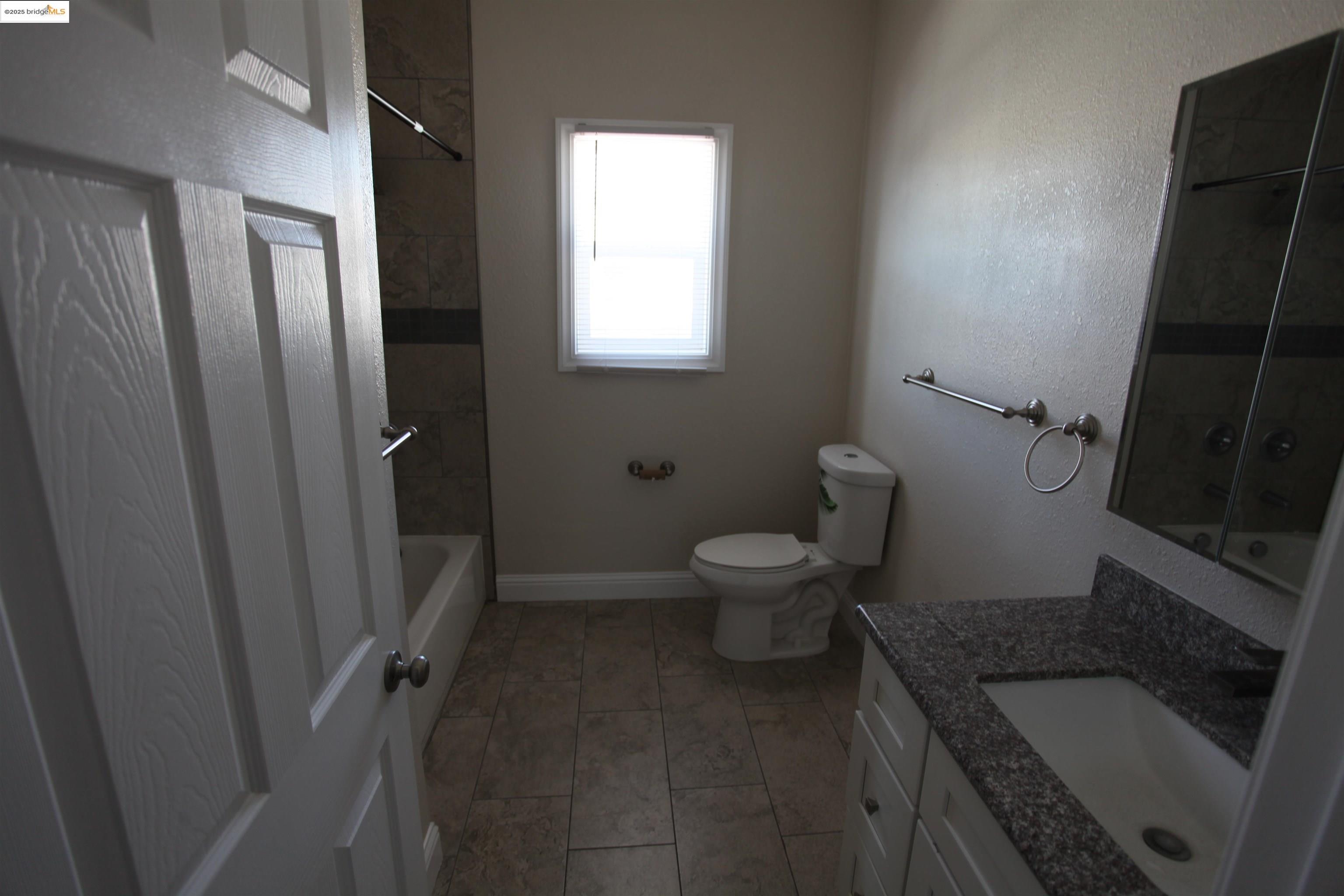 50 Main Street Isleton, CA 95641 - Photo 52 of 59 a bathroom with a toilet and a shower
