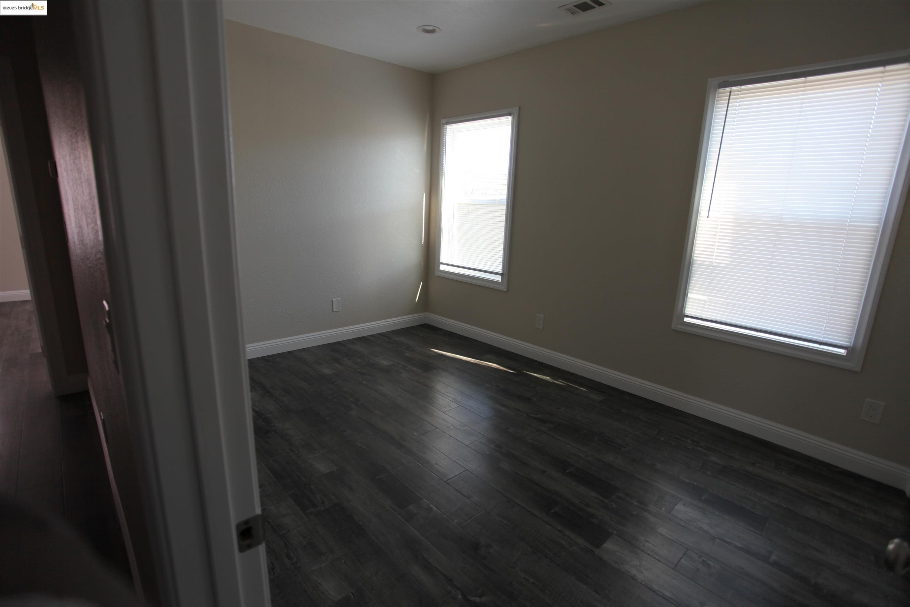 50 Main Street Isleton, CA 95641 - Photo 55 of 59 a view of an empty room with wooden floor and a window