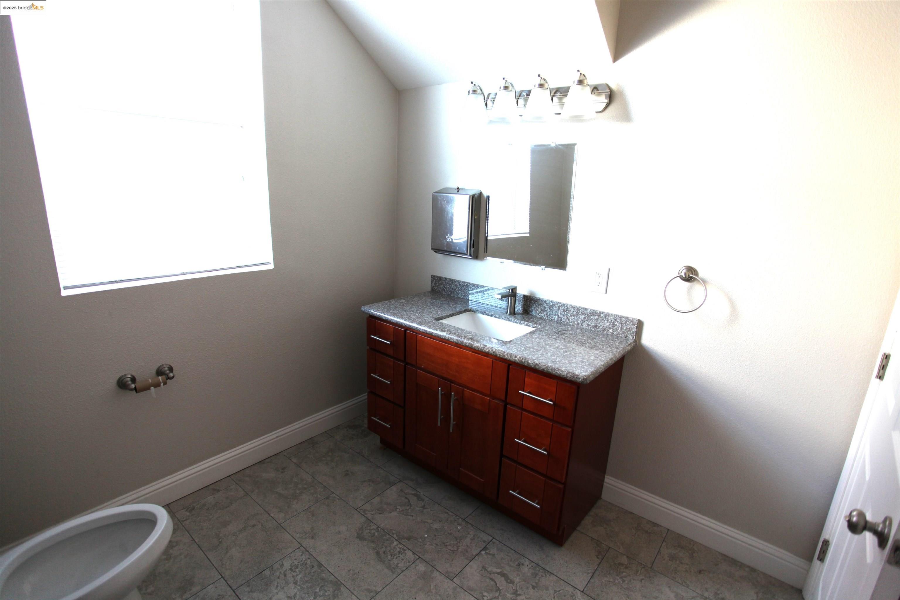 50 Main Street Isleton, CA 95641 - Photo 6 of 59 a bathroom with a sink and a mirror