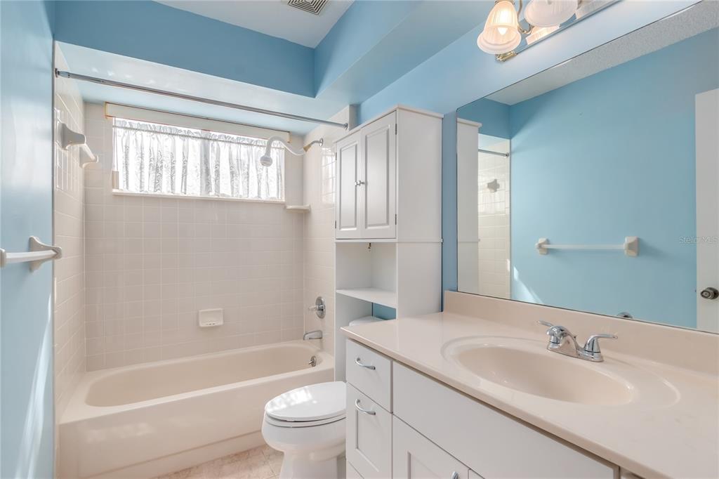 8156 Southwest 108th Ln Road Ocala, FL 34481 - Photo 20 of 50 a bathroom with a granite countertop sink toilet and shower