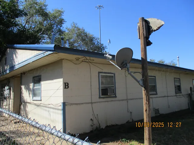 a front view of a house with parking