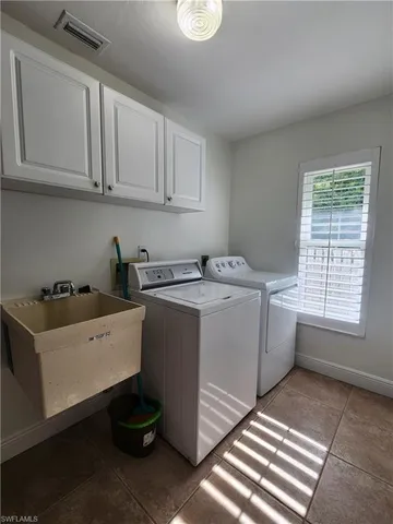 a living room with patio furniture