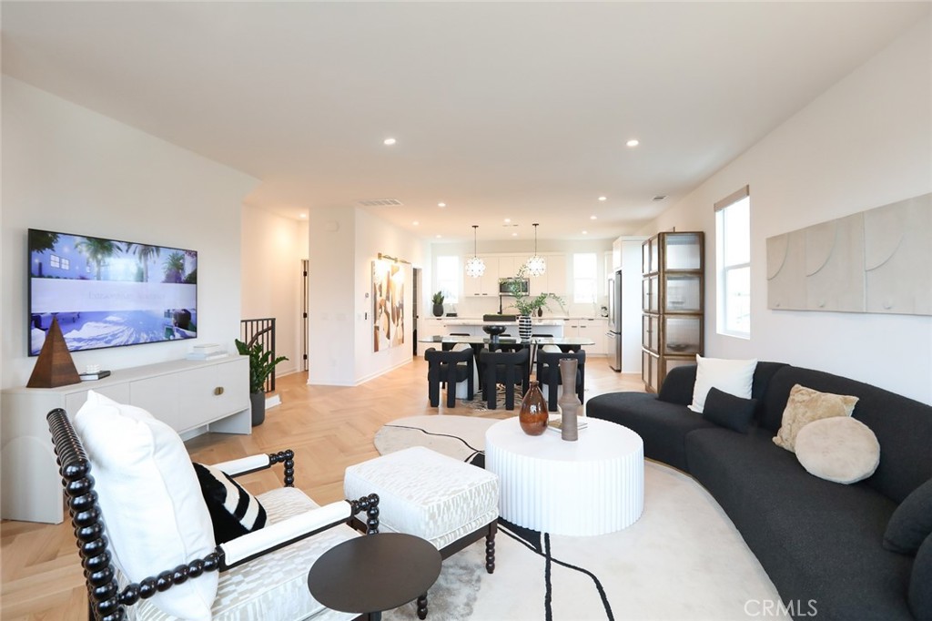 151 Jessup Way Tustin, CA 92780 - Photo 11 of 33 a living room with furniture kitchen view and a large window