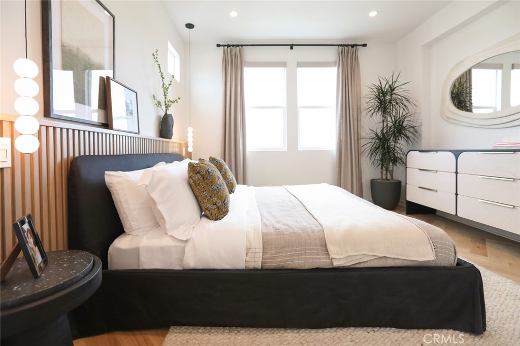 151 Jessup Way Tustin, CA 92780 - Photo 22 of 33 a bedroom with a large bed and a window