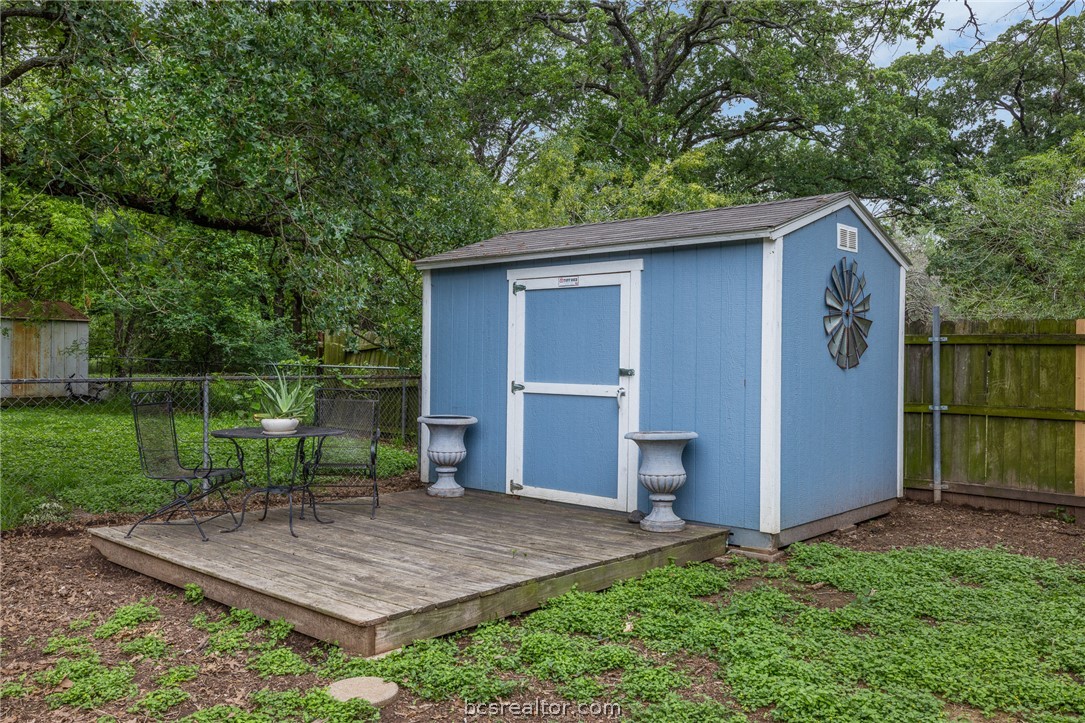 2287 North Earl Rudder Freeway Bryan, TX 77803 - Photo 19 of 32 a view of backyard with wooden fence and large trees