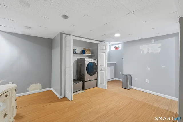 a bedroom with a bed and utility