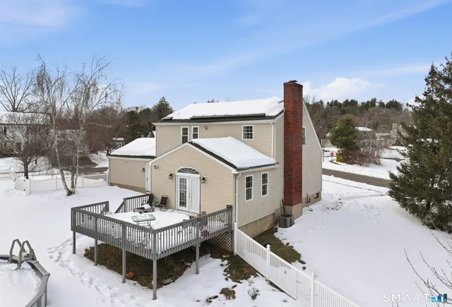 a aerial view of a house with roof deck front of house