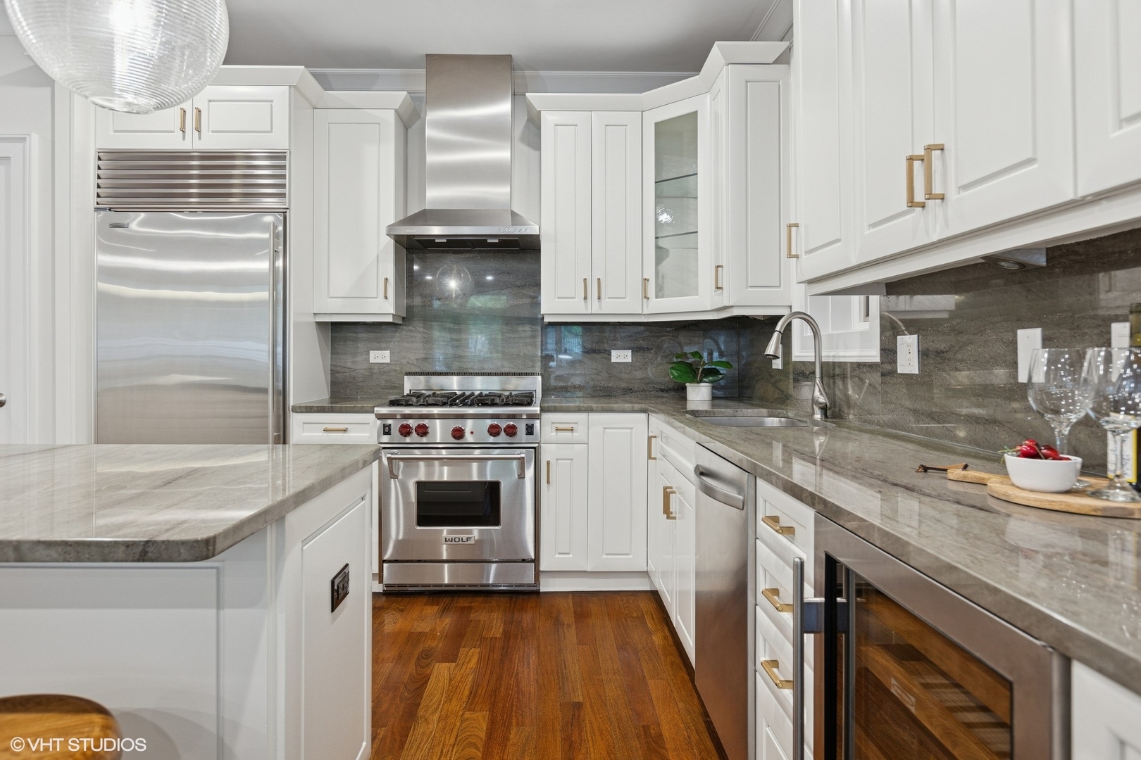 1035 West Monroe Street, Unit 1 Chicago, IL 60607 - Photo 11 of 27 a kitchen with stainless steel appliances granite countertop a sink and a stove