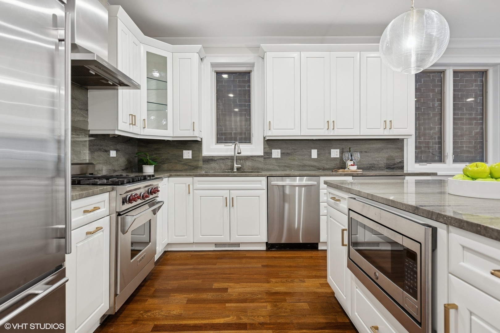 1035 West Monroe Street, Unit 1 Chicago, IL 60607 - Photo 12 of 27 a kitchen with stainless steel appliances granite countertop a sink a stove and cabinets