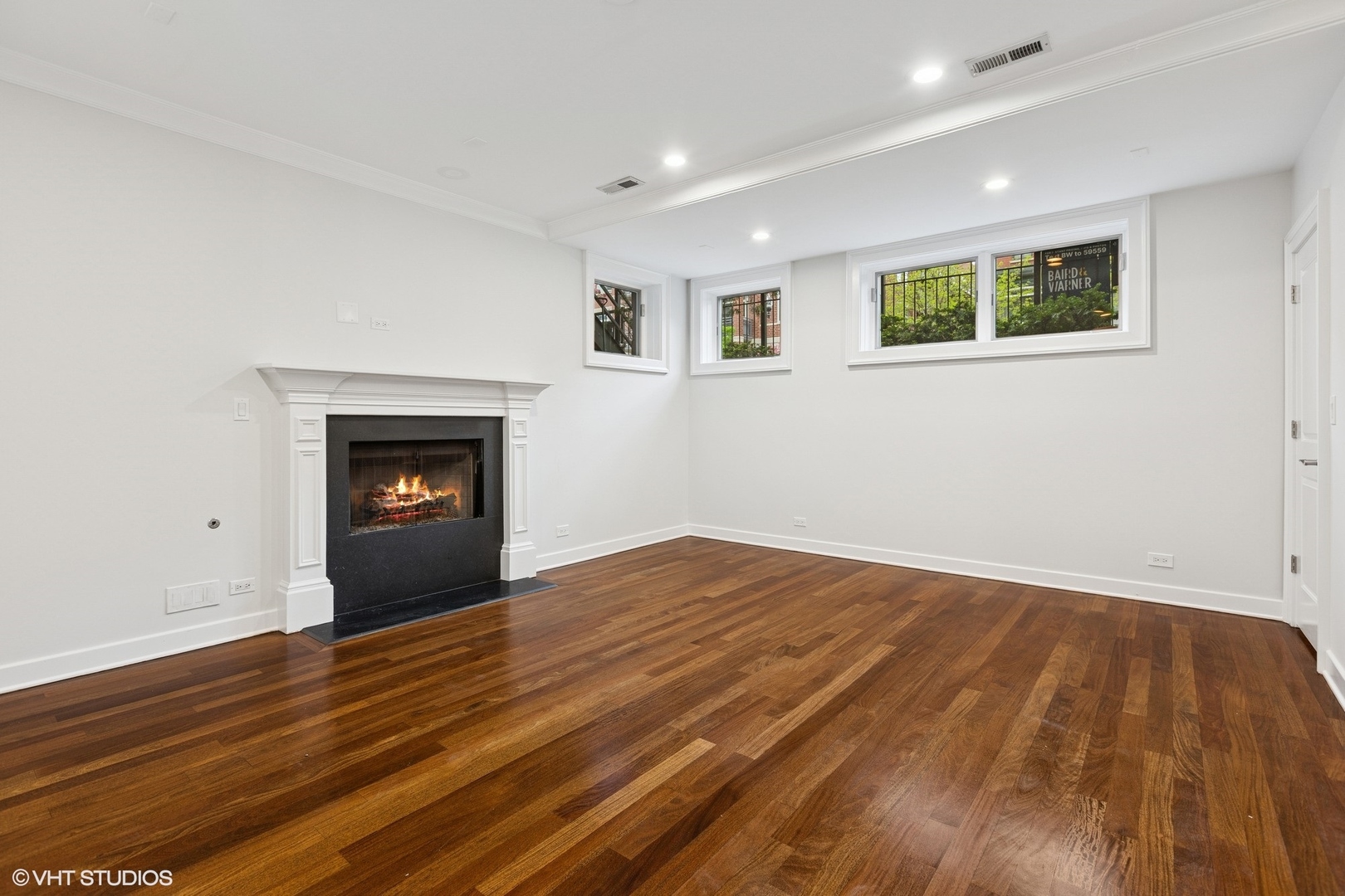 1035 West Monroe Street, Unit 1 Chicago, IL 60607 - Photo 17 of 27 a view of empty room with wooden floor and fireplace