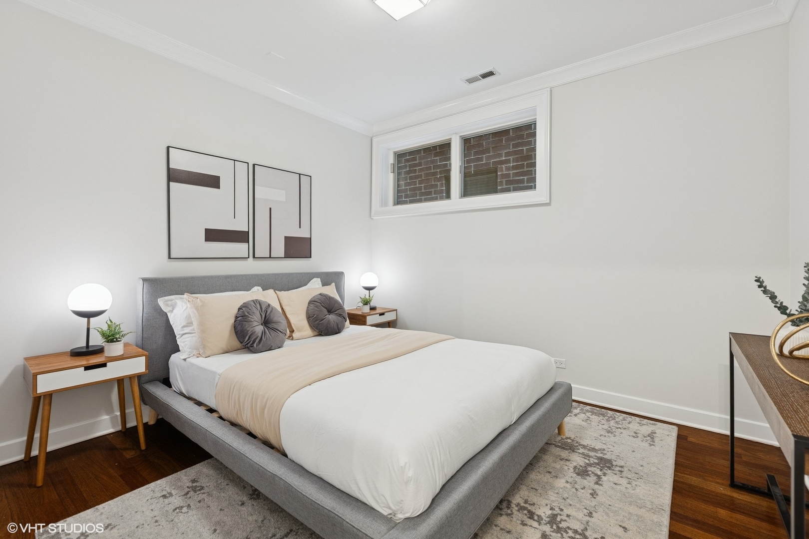 1035 West Monroe Street, Unit 1 Chicago, IL 60607 - Photo 18 of 27 a bedroom with a bed and wooden floor