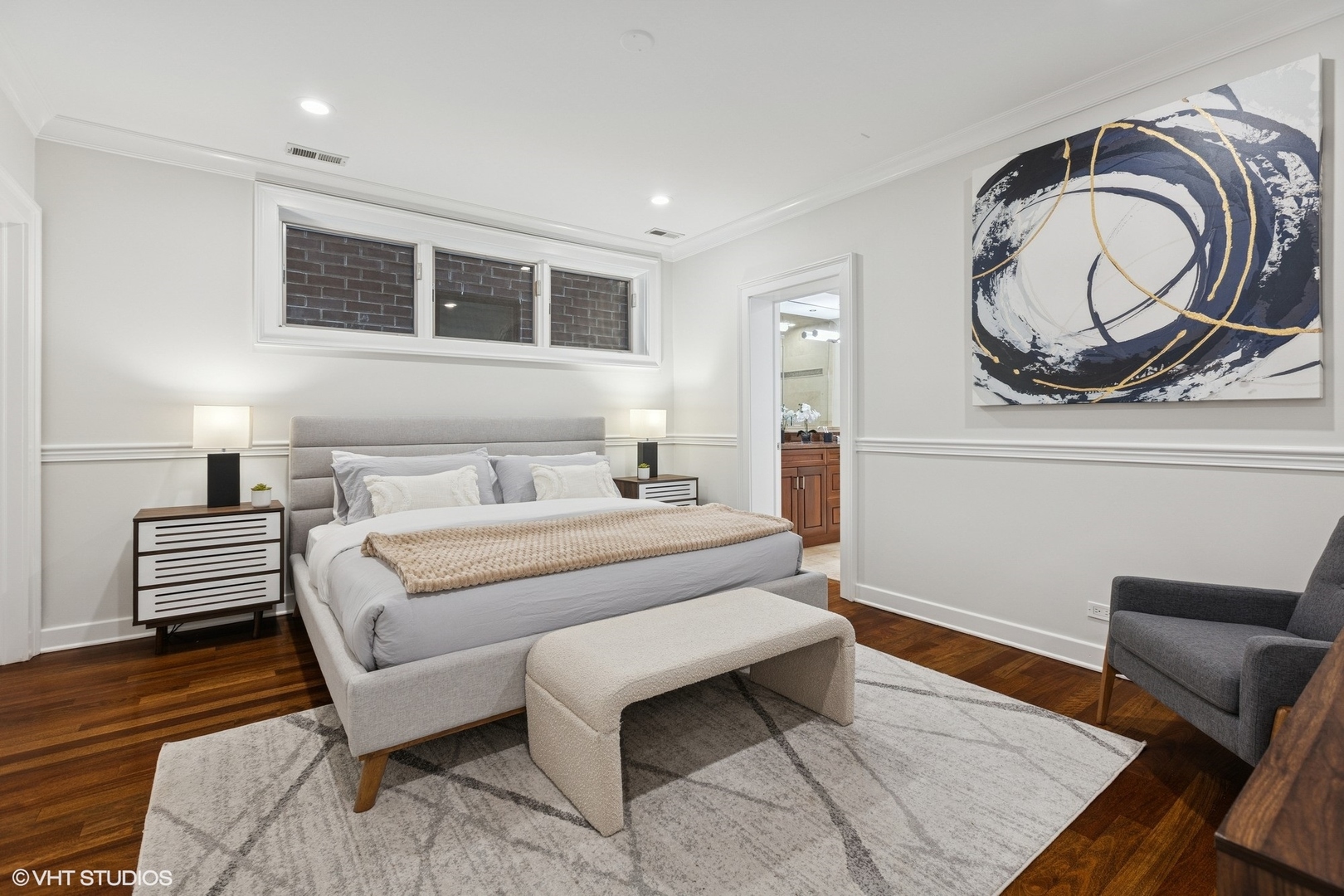 1035 West Monroe Street, Unit 1 Chicago, IL 60607 - Photo 20 of 27 a bedroom with a bed and wooden floor