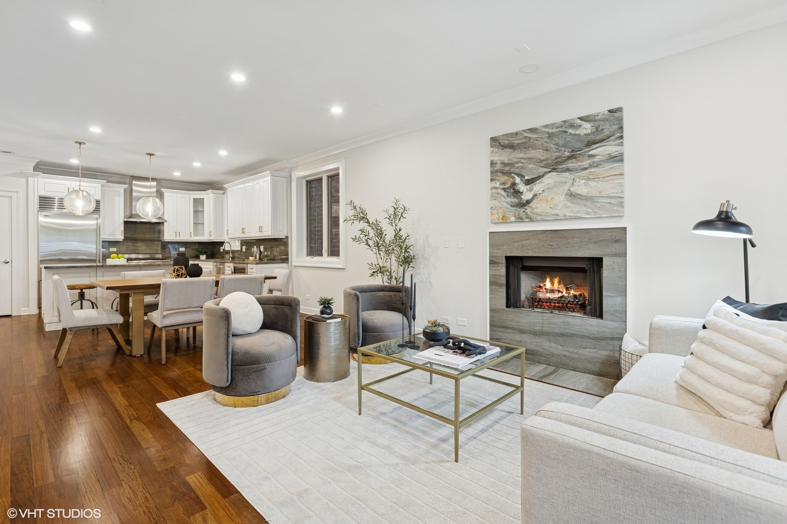 1035 West Monroe Street, Unit 1 Chicago, IL 60607 - Photo 4 of 27 a living room with furniture and a fireplace