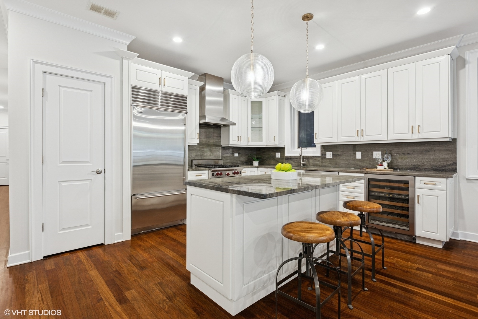 1035 West Monroe Street, Unit 1 Chicago, IL 60607 - Photo 10 of 27 a kitchen with stainless steel appliances granite countertop a stove a sink dishwasher a refrigerator and white cabinets with wooden floor