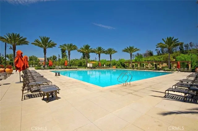 a view of swimming pool with outdoor seating and yard