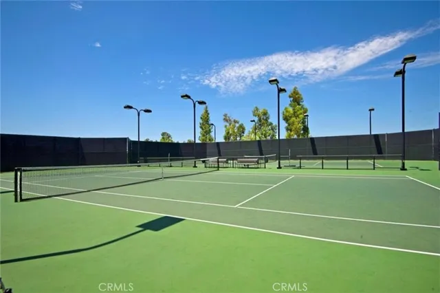a view of an outdoor space and tennis court