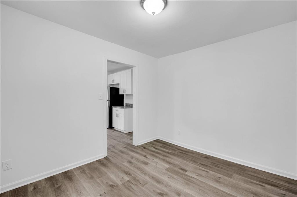 1586 Kings Road Marietta, GA 30062 - Photo 13 of 66 a view of a room with wooden floor and a ceiling fan