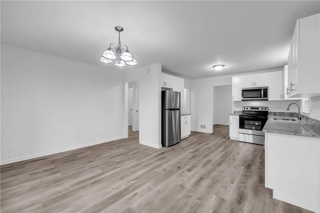 1586 Kings Road Marietta, GA 30062 - Photo 23 of 66 a view of a kitchen with electric appliances